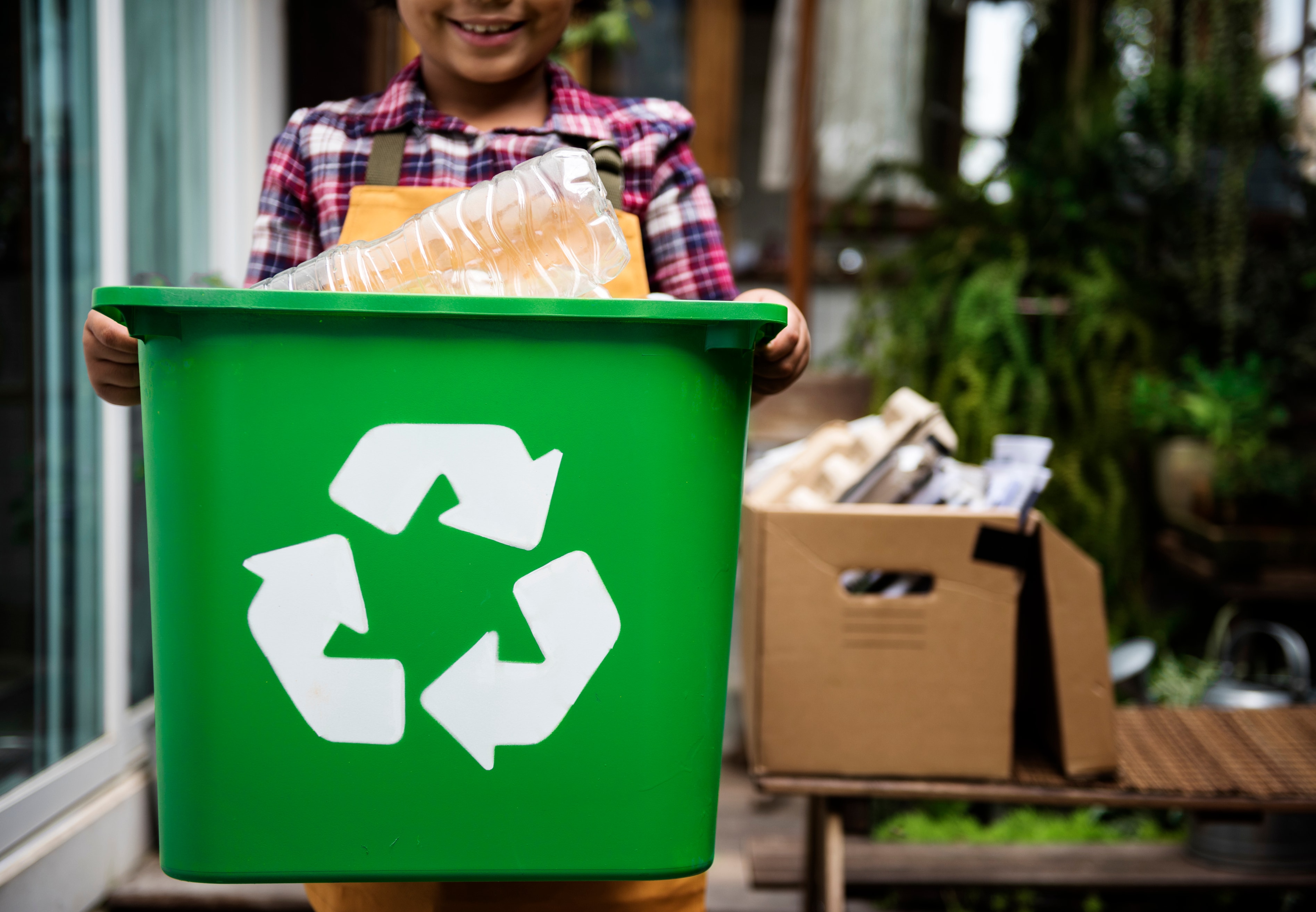 Child carrying recycling caddy