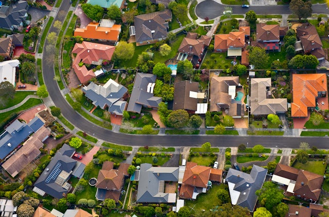 aerial shot of suburban street and homes